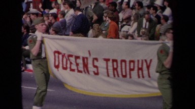 1967: a woman in costume riding on a beautiful float in a parade LOS ANGELES