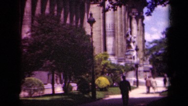 1939: a man enjoys a leisurely walk down a shady street. PARIS FRANCE