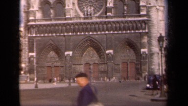 1939: people walking and driving through the traditionally built modern city