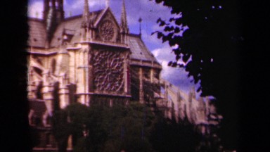 1939: towers rise high above a stately old gothic church PARIS FRANCE
