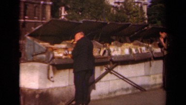 1939: a group of people stand around looking in dumpsters PARIS FRANCE