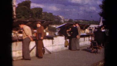 1939: people talking,hanging out,shopping and sightseeing in the roadside PARIS