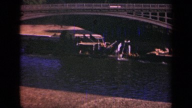 1939: barge proceeding on a river under a bridge PARIS FRANCE