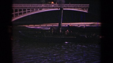 1939: barge proceeding on a river under a bridge PARIS FRANCE