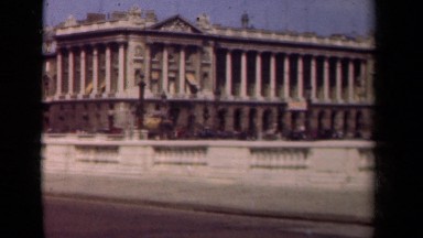 1939: a busy street with traffic overlooking an old architectural wonder PARIS