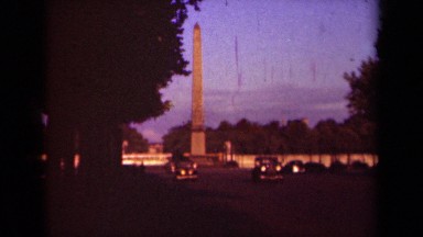 1939: there are many number of people travelling with their vehicles on the city