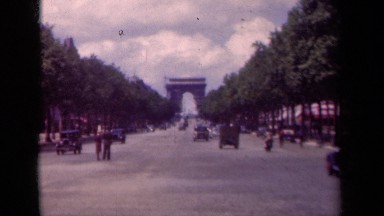 1939: People Travel Along a Road to and from the Arc de Triomphe, Paris France