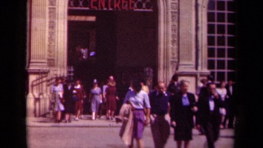 1939: a large crowd of people are entering and exiting a building PARIS FRANCE