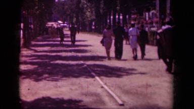 1939: people stroll down a path in a park on a sunny day PARIS FRANCE