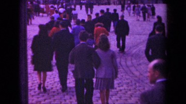 1939: a crowd of people walk in a plaza on a cloudy day PARIS FRANCE