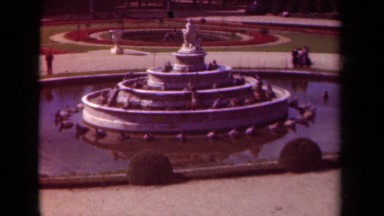1939: number of people are moving around a large pool of water pond PARIS FRANCE