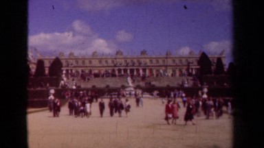 1939: lots of smartly dressed people are strolling in a plaza PARIS FRANCE