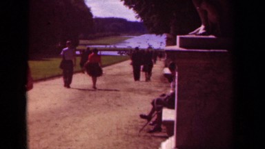 1939: a group of people are strolling on a path towards a pond PARIS FRANCE