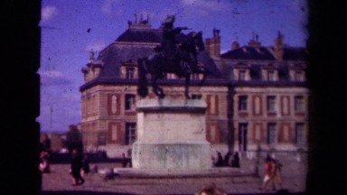 1939: Crowds of People Walk in the Plaza of a Historic Building Paris France