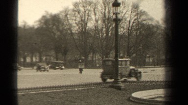 1947: Antique Cars Driving Through the Streets of Paris, France