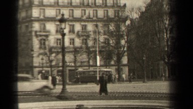 1947: People Walking Through a Busy Town Square in Paris, France