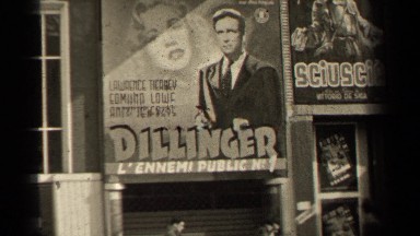 1947: people walking past billboard signs PARIS FRANCE