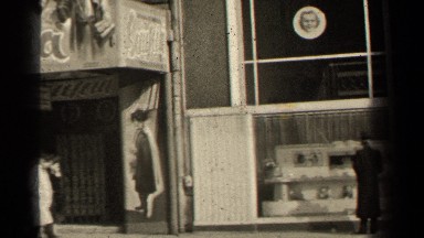 1947: Murals and Cutouts Adorn Facade That Reads "Sciuscia"