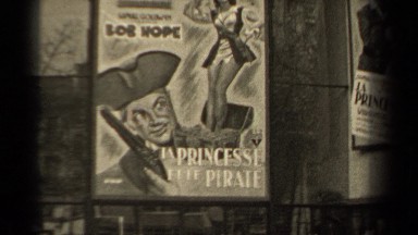 1947: tv show posters and advertisements on a wall PARIS FRANCE
