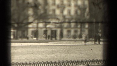 1947: cars driving past buildings in a neighborhood PARIS FRANCE