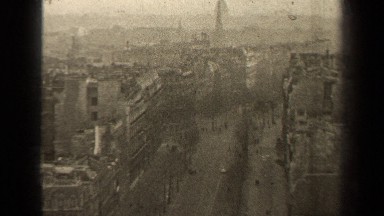 1947: cars drive down a city street on a winter's day PARIS FRANCE