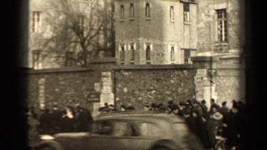 1947: number of people are walking by near a large building PARIS FRANCE