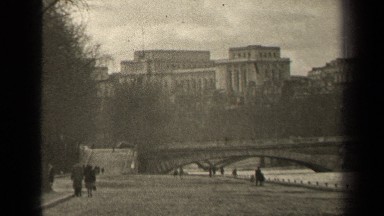 1947: a vast area of land is covered by water and number of people walking on