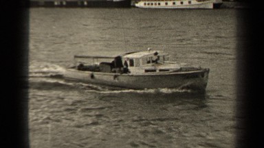 1947: Motorboat Travels Down Body of Water Paris France