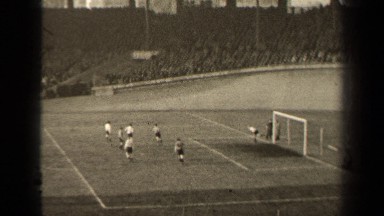 1947: men run around playing a game on a soccer field PARIS FRANCE