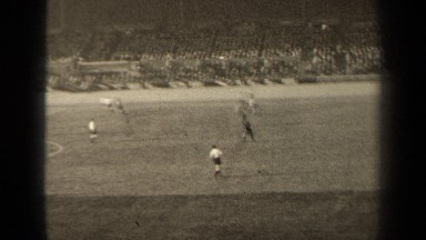 1947: football match is going on , two team player play a match, people enjoying
