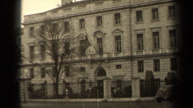 1947: people walking and a flag flying outside of a building PARIS FRANCE