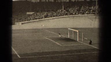 1947: a black and white video of a professional soccer game. PARIS FRANCE