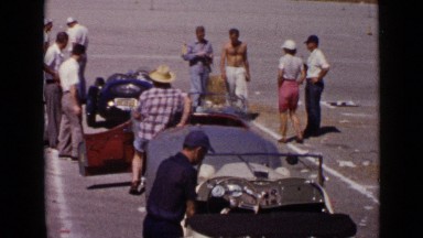 1952: man sitting in his car and closed door of car SAN DIEGO