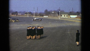 1947: Women in Blue Uniforms Marching on Parking Lot in New York