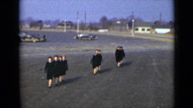 1947: girls who wearing attractive black dress cross road NEW YORK
