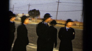 1947: beautiful young women dressed in uniforms with ties and hats gathered