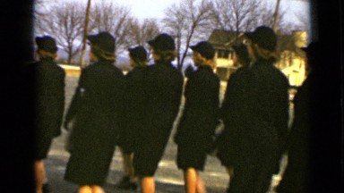 1947: women wearing dark military uniforms march and turn in formation NEW YORK