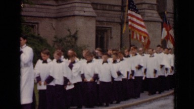 1947: large group of choir boys walking on sidewalk along street NEW YORK