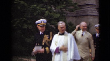 1947: the vip is walking with security, saying hello to crowd NEW YORK