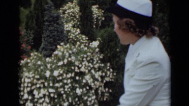 1947: woman sitting outside observing garden, and enjoying it. NEW YORK