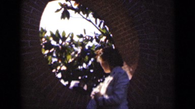 1947: woman looking out of circular window at daytime NEW YORK