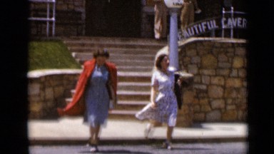 1947: two women coming downstairs and crossing street NEW YORK