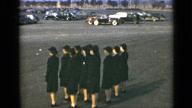 1947: group of uniformed women belonging to organization marching in synchrony