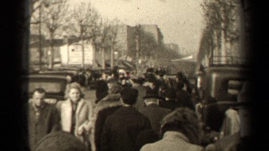 1947: Large Group of People Walking on Sidewalk Downtown, Paris France