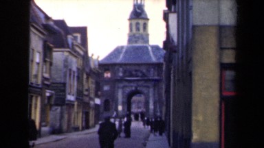 1946: People Walking and Standing Near Building in Netherlands