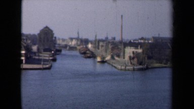 1946: huge water body running through big and busy city with boats