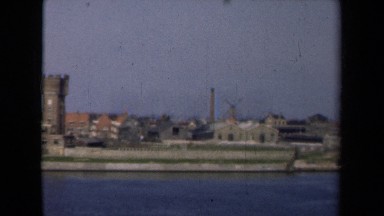 1946: an industrial area on shore of river with blue water NETHERLANDS