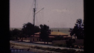 1946: View of Suez Canal Area with Surrounding Beach, Water, and Buildings