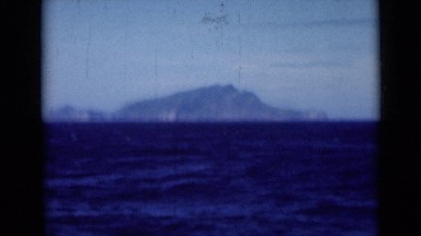 1946: deep blue sea lying calm before huge mountain range SUEZ CANAL EGYPT