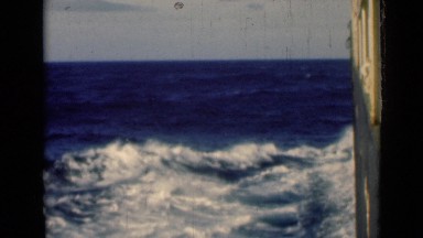 1946: ship is travelling fast on ocean and waves also moving fast. SUEZ CANAL